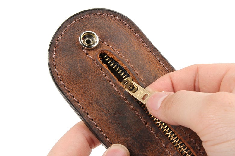 Someone Invented a Leather Coin Purse That Doubles as a Self